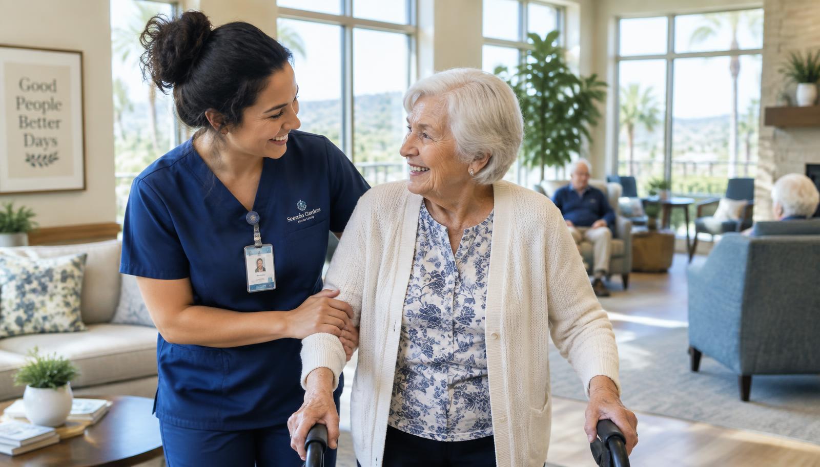 Caregiver assisting a senior resident in a bright assisted living common area in Contra Costa County